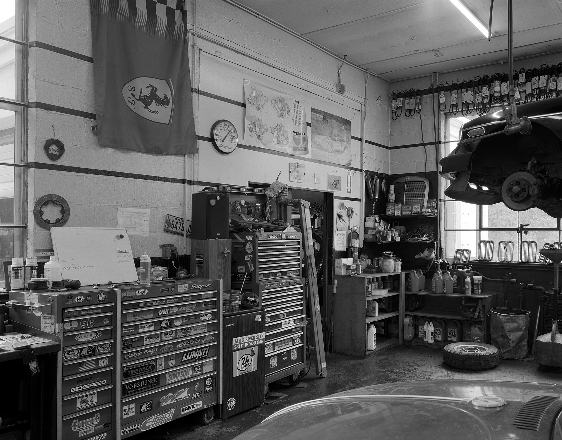 Black & white interior shot of AVA Restoration services' tool boxes