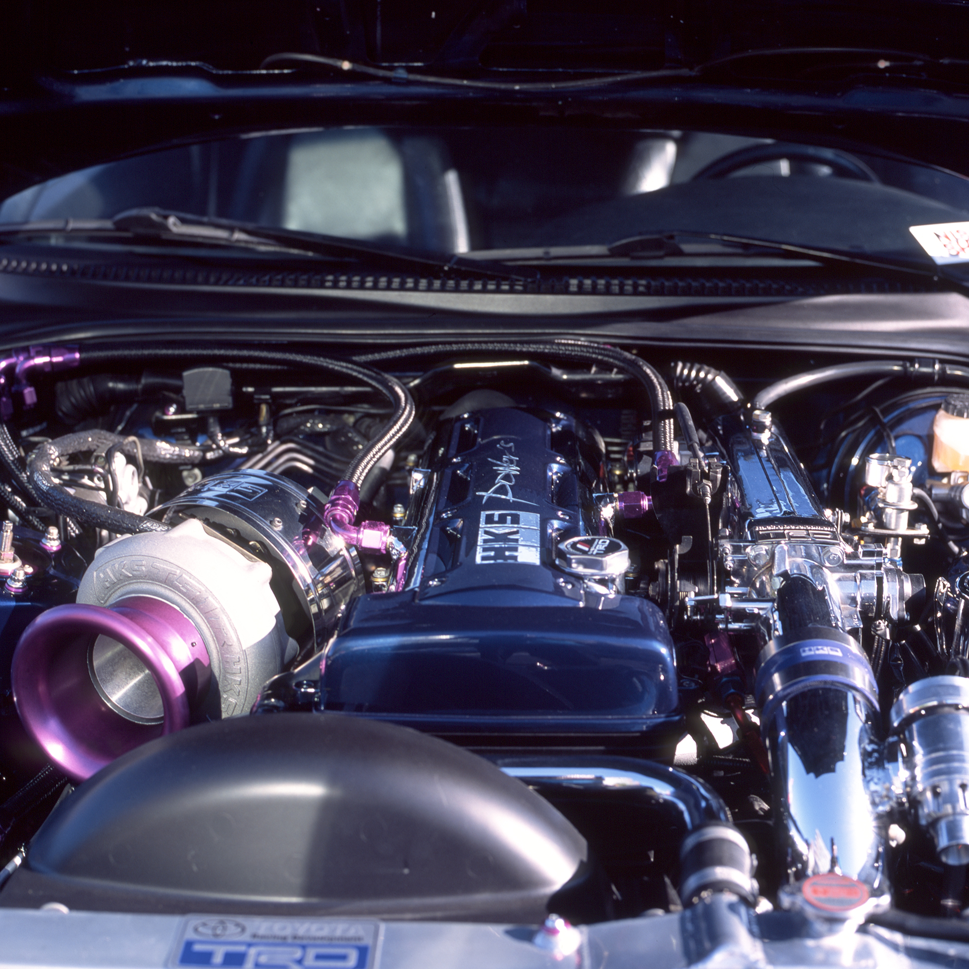 Toyota Supra Mk4 engine bay with a lot of shiny HKS upgrades