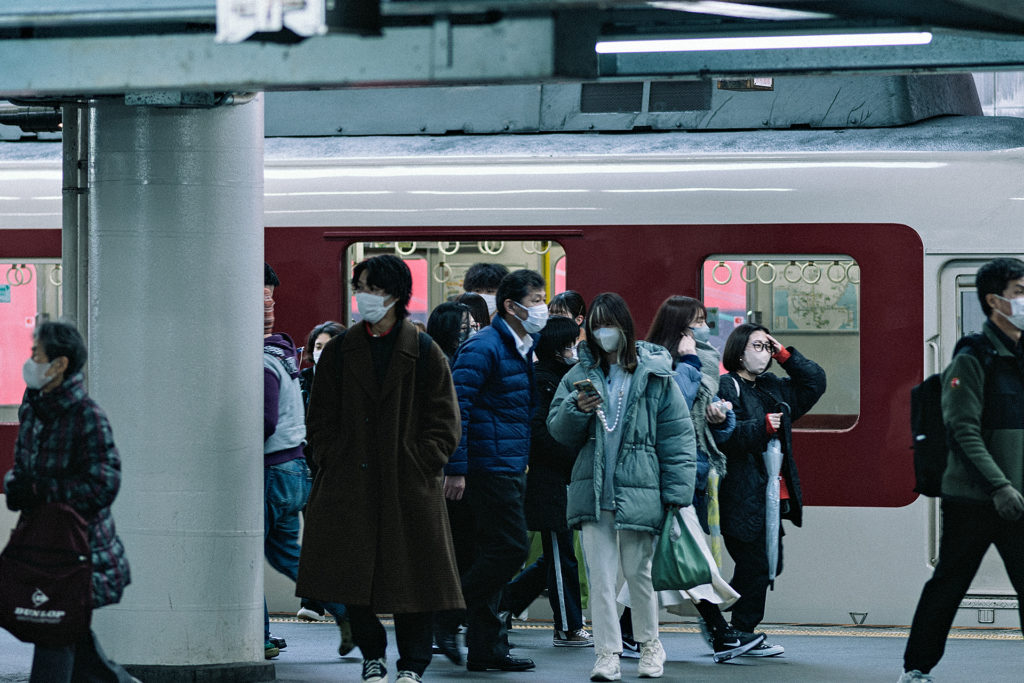People getting off a train in Japan