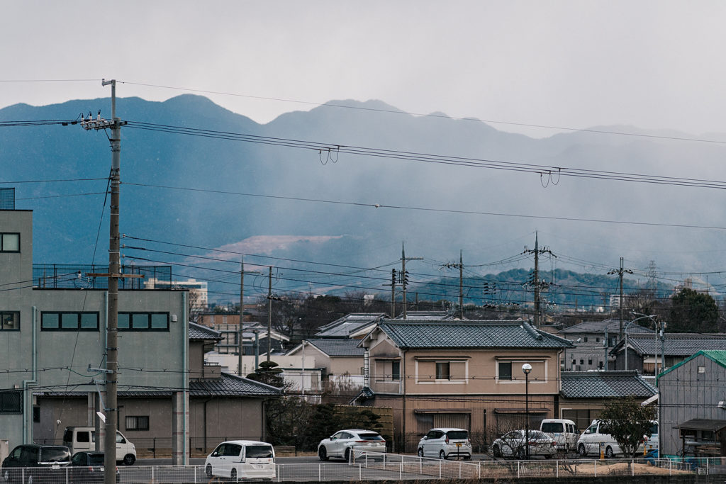 Low clouds and snow crossing the hills in Nara
